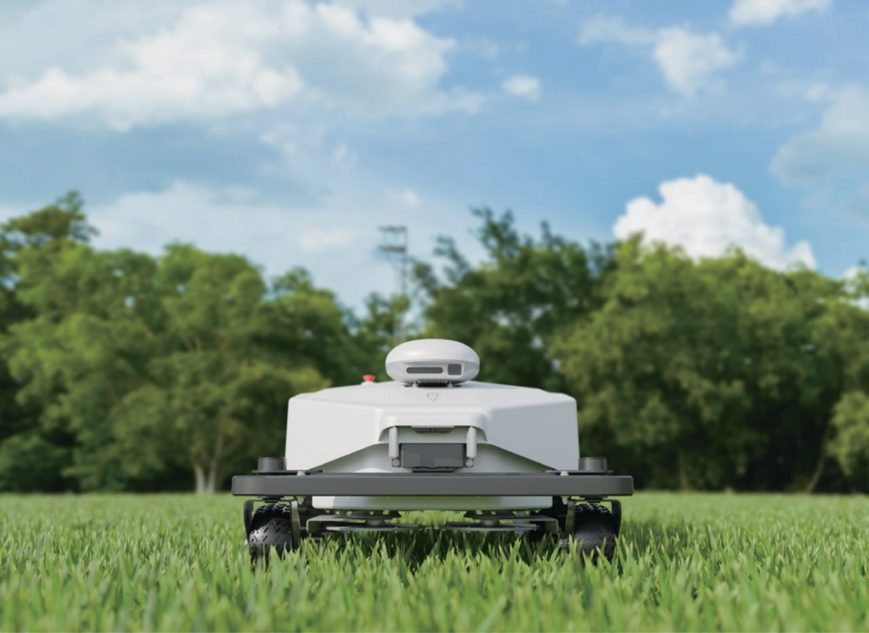 FJD FRX robotic mower front-on in long grass