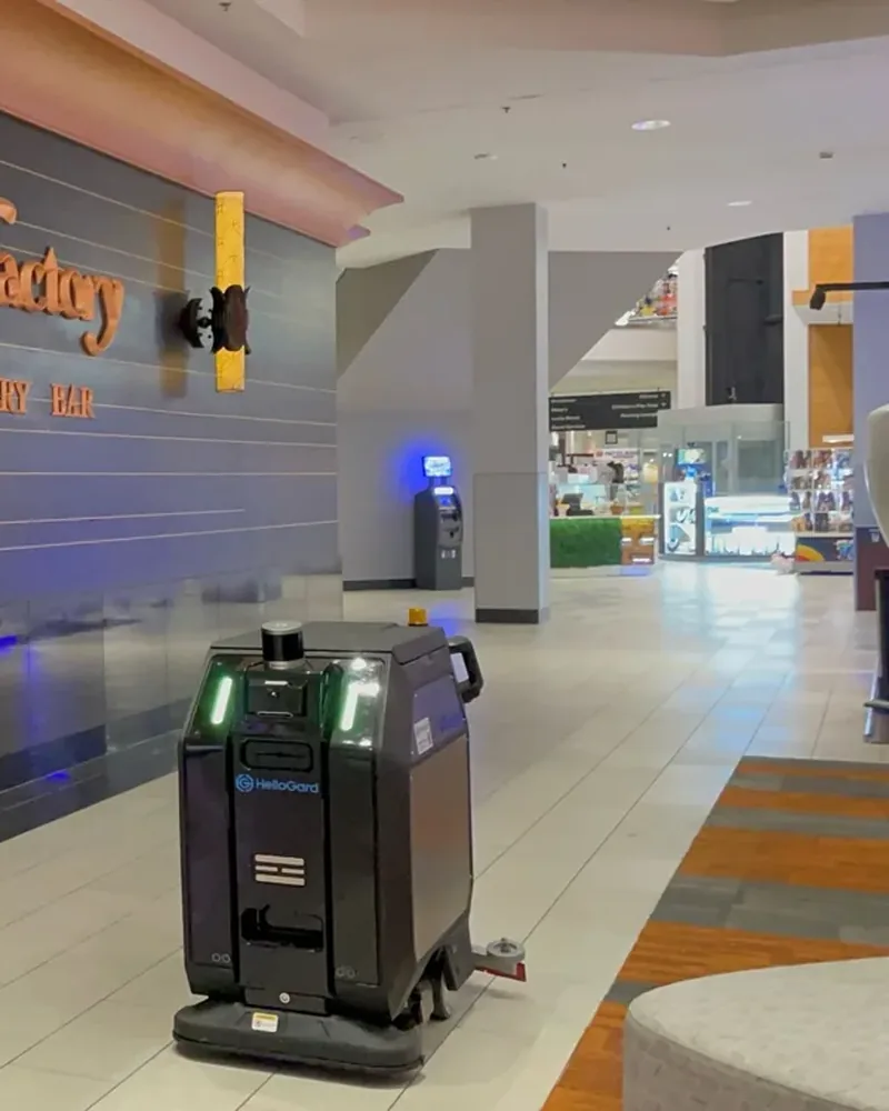 CenoBots L50 scrubbing outside a restaurant